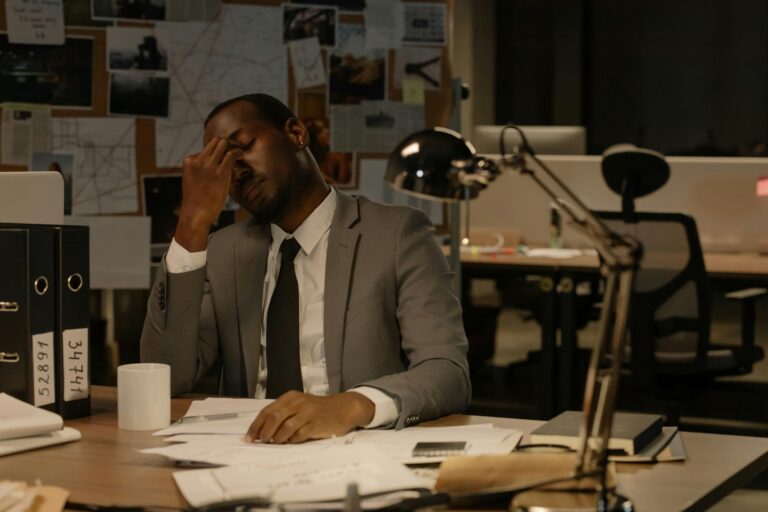 Photo by cottonbro studio: https://www.pexels.com/photo/man-in-gray-suit-sitting-in-front-of-his-paperwork-on-the-wooden-table-8369254/
